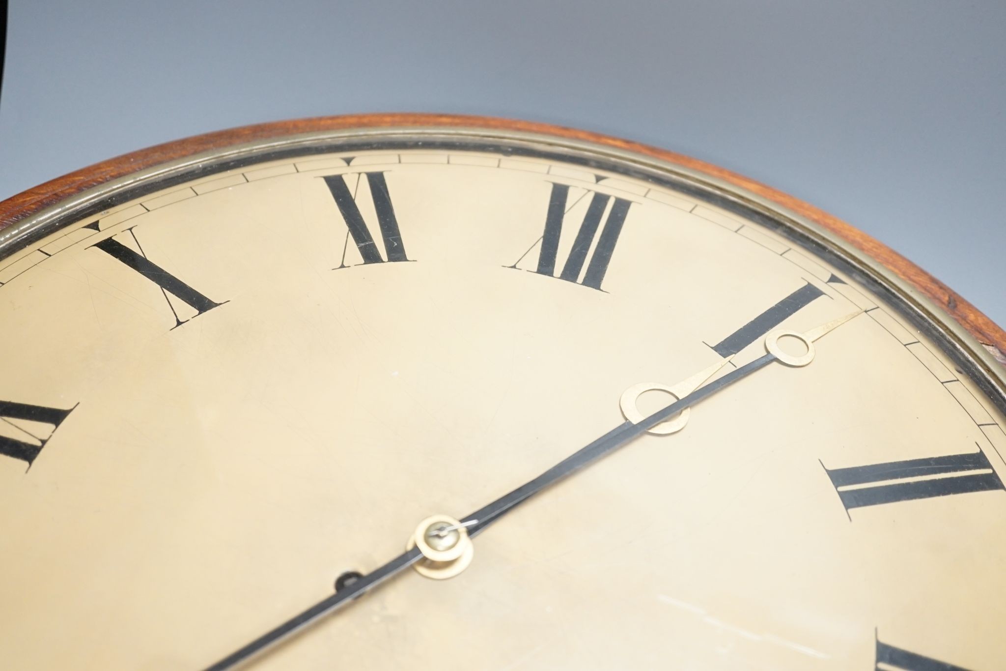 A large Victorian oak-cased dial clock, 56 cms diameter.